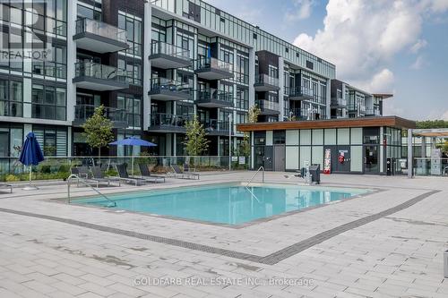 317 - 415 Sea Ray Avenue, Innisfil, ON - Outdoor With In Ground Pool With Facade