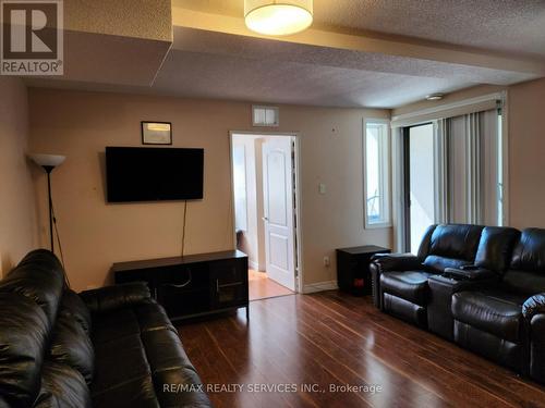 212 - 7405 Goreway Drive W, Mississauga, ON - Indoor Photo Showing Living Room