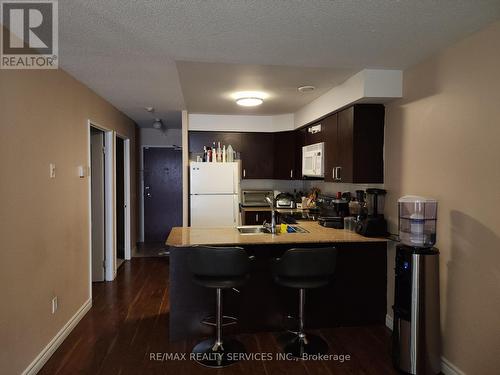 212 - 7405 Goreway Drive W, Mississauga, ON - Indoor Photo Showing Kitchen With Double Sink