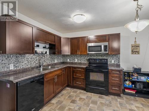 2-96 Lewes Boulevard, Whitehorse, YT - Indoor Photo Showing Kitchen With Double Sink