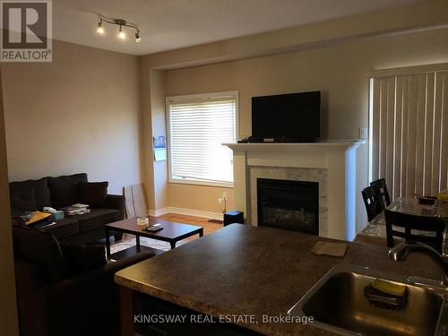 16 - 541 Winston Road, Grimsby, ON - Indoor Photo Showing Living Room With Fireplace