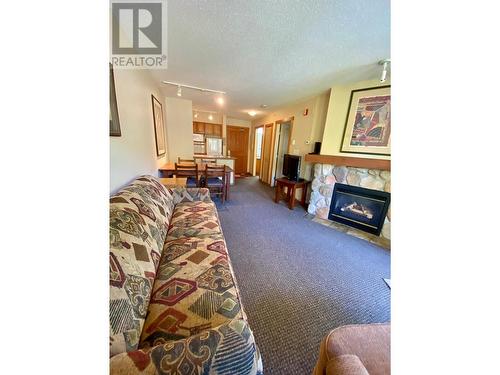 2050 Summit Drive Unit# 306, Panorama, BC - Indoor Photo Showing Living Room With Fireplace