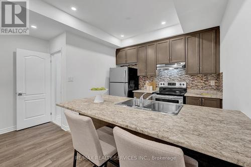 12 - 35 Heron Park Place, Toronto, ON - Indoor Photo Showing Kitchen With Double Sink With Upgraded Kitchen