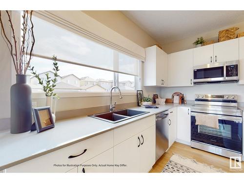 648 174 Av Ne, Edmonton, AB - Indoor Photo Showing Kitchen With Double Sink