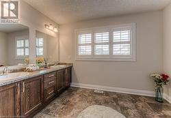 Bathroom featuring vanity and a textured ceiling - 