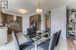 Dining area featuring light wood-type flooring - 