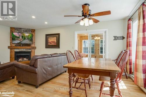 110-9 - 1052 Rat Bay Road, Lake Of Bays (Franklin), ON - Indoor Photo Showing Dining Room With Fireplace