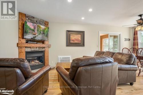 110-9 - 1052 Rat Bay Road, Lake Of Bays (Franklin), ON - Indoor Photo Showing Living Room With Fireplace