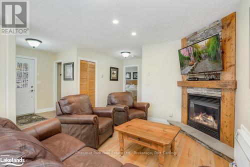 110-9 - 1052 Rat Bay Road, Lake Of Bays (Franklin), ON - Indoor Photo Showing Living Room With Fireplace