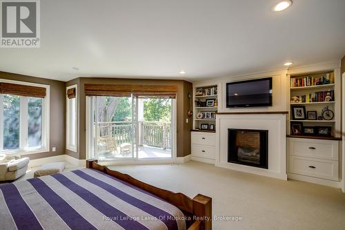 230 Ecclestone Drive, Bracebridge (Macaulay), ON - Indoor Photo Showing Bedroom With Fireplace