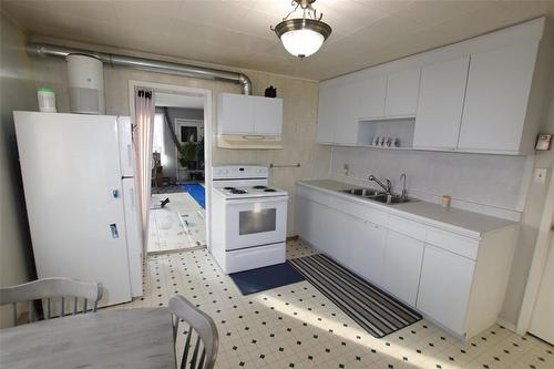 121 Paul Avenue, The Pas, MB - Indoor Photo Showing Kitchen With Double Sink