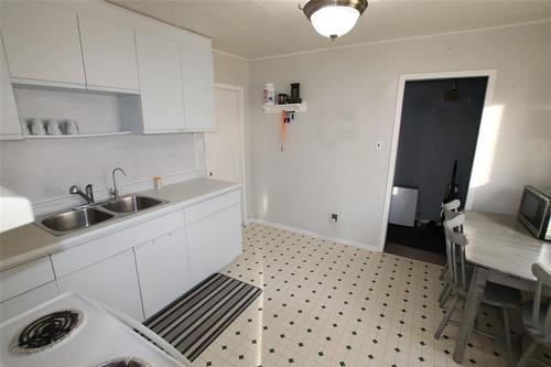 121 Paul Avenue, The Pas, MB - Indoor Photo Showing Kitchen With Double Sink