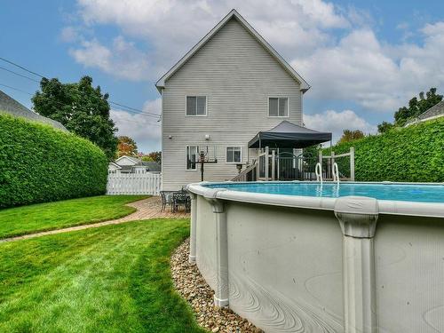 Back facade - 85 Ch. Notre-Dame, Blainville, QC - Outdoor With Above Ground Pool