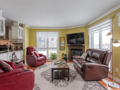 Salon - 202-808 Rue De La Soeur-Marie-Rose, Terrebonne (Lachenaie), QC - Indoor Photo Showing Living Room With Fireplace