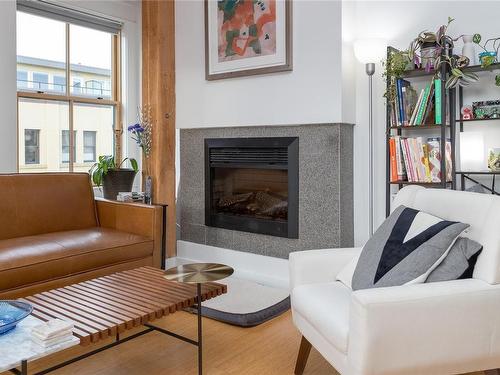 301-610 Johnson St, Victoria, BC - Indoor Photo Showing Living Room With Fireplace