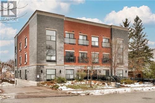 View of snow covered building - 15 Devitt Avenue S Unit# 103, Waterloo, ON - Outdoor