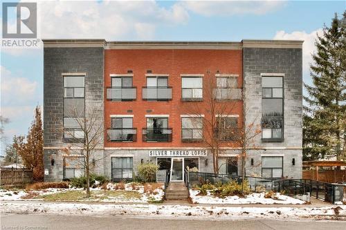 View of snow covered property - 15 Devitt Avenue S Unit# 103, Waterloo, ON - Outdoor