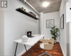 Home office featuring hardwood / wood-style flooring - 