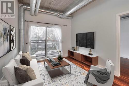 Living room with hardwood / wood-style floors - 15 Devitt Avenue S Unit# 103, Waterloo, ON - Indoor