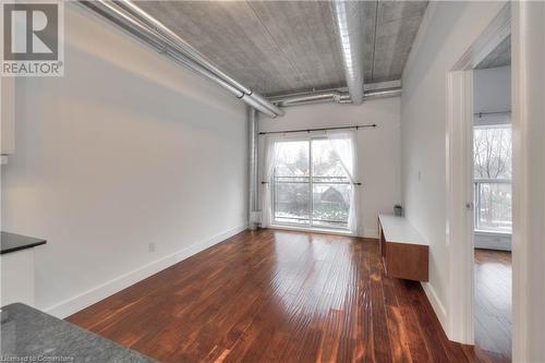 Spare room with dark hardwood / wood-style flooring - 15 Devitt Avenue S Unit# 103, Waterloo, ON - Indoor Photo Showing Other Room