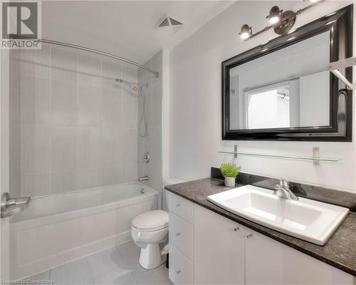 Full bathroom featuring tile patterned floors, vanity, toilet, and tiled shower / bath - 15 Devitt Avenue S Unit# 103, Waterloo, ON - Indoor Photo Showing Bathroom