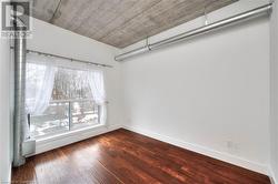 Unfurnished room featuring hardwood / wood-style flooring - 