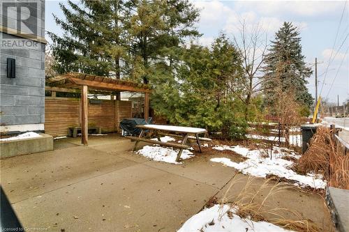 Snow covered patio with area for grilling - 15 Devitt Avenue S Unit# 103, Waterloo, ON - Outdoor