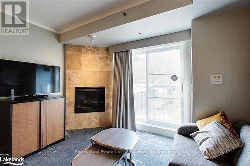 303 - 220 Gord Canning Drive, Blue Mountains (Blue Mountain Resort Area), ON - Indoor With Fireplace