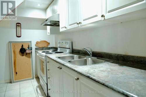 #Bsmt - 18 Sandrift Square, Toronto, ON - Indoor Photo Showing Kitchen With Double Sink