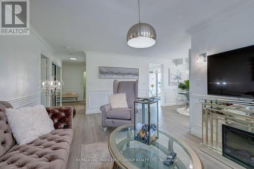 213 - 1000 The Esplanade N, Pickering, ON - Indoor Photo Showing Living Room With Fireplace