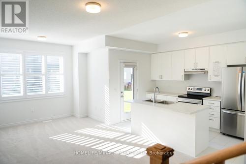 45 Edminston Drive, Centre Wellington, ON - Indoor Photo Showing Kitchen With Double Sink