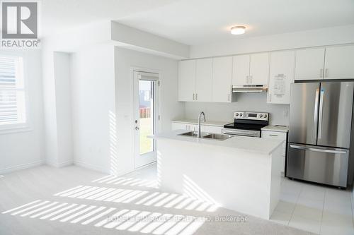 45 Edminston Drive, Centre Wellington, ON - Indoor Photo Showing Kitchen With Double Sink