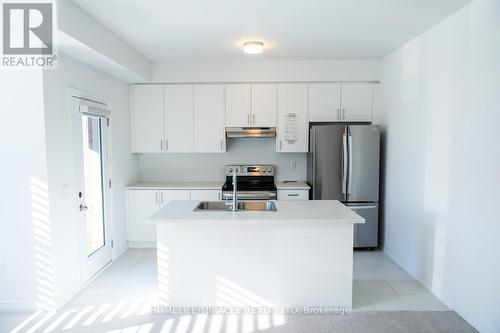 45 Edminston Drive, Centre Wellington, ON - Indoor Photo Showing Kitchen With Double Sink