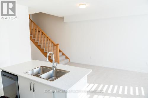 45 Edminston Drive, Centre Wellington, ON - Indoor Photo Showing Kitchen With Double Sink