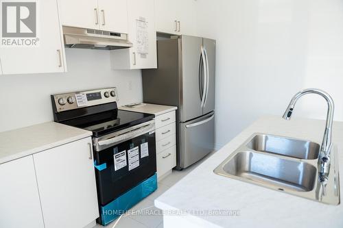 45 Edminston Drive, Centre Wellington, ON - Indoor Photo Showing Kitchen With Double Sink