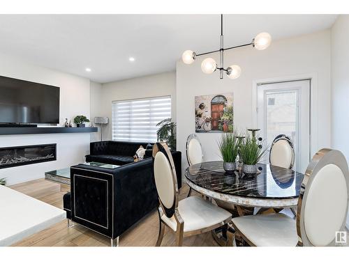 8032 174A Av Nw, Edmonton, AB - Indoor Photo Showing Dining Room With Fireplace