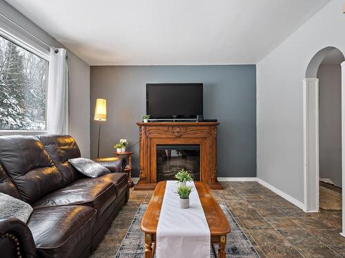 Living room - 2697 Route 323 N., Amherst, QC - Indoor Photo Showing Living Room With Fireplace