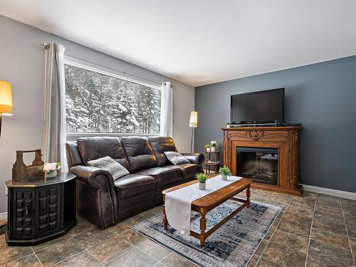 Living room - 2697 Route 323 N., Amherst, QC - Indoor Photo Showing Living Room With Fireplace