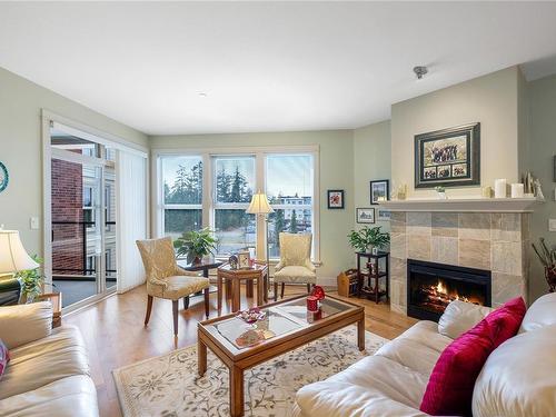 301-6310 Mcrobb Ave, Nanaimo, BC - Indoor Photo Showing Living Room With Fireplace