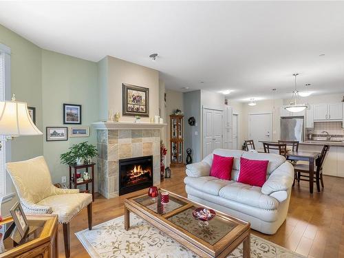 301-6310 Mcrobb Ave, Nanaimo, BC - Indoor Photo Showing Living Room With Fireplace