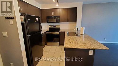 410 - 80 Esther Lorrie Drive, Toronto, ON - Indoor Photo Showing Kitchen With Stainless Steel Kitchen With Double Sink