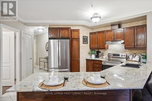 410 - 112 Simcoe Road, Bradford West Gwillimbury, ON - Indoor Photo Showing Kitchen With Stainless Steel Kitchen