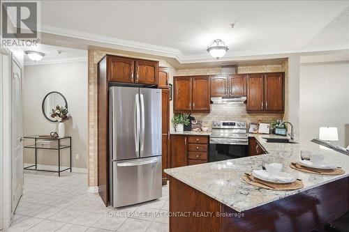 410 - 112 Simcoe Road, Bradford West Gwillimbury, ON - Indoor Photo Showing Kitchen With Stainless Steel Kitchen