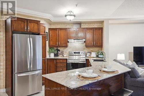 410 - 112 Simcoe Road, Bradford West Gwillimbury, ON - Indoor Photo Showing Kitchen With Stainless Steel Kitchen