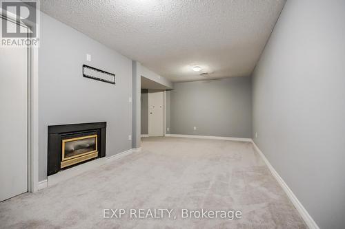 2 - 125 Sekura Crescent, Cambridge, ON - Indoor Photo Showing Other Room With Fireplace