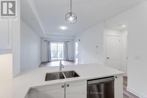 110 - 50 Lakebreze Drive, Clarington, ON - Indoor Photo Showing Kitchen With Double Sink