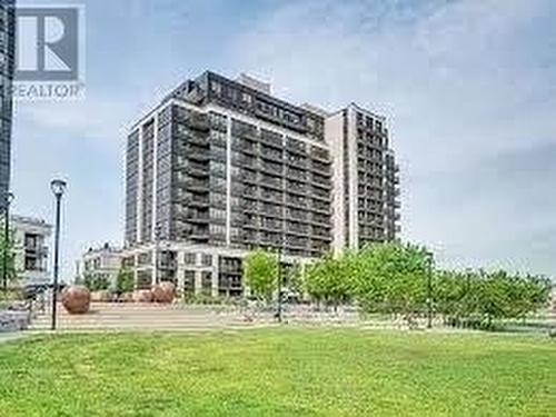 412 - 55 De Boers Drive, Toronto, ON - Outdoor With Balcony With Facade