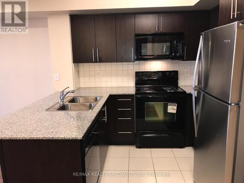 412 - 55 De Boers Drive, Toronto, ON - Indoor Photo Showing Kitchen With Double Sink