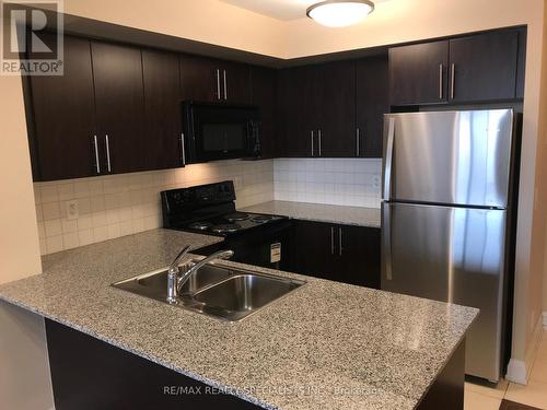 412 - 55 De Boers Drive, Toronto, ON - Indoor Photo Showing Kitchen With Double Sink