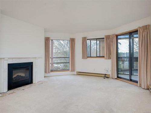 404-1560 Hillside Ave, Victoria, BC - Indoor Photo Showing Living Room With Fireplace